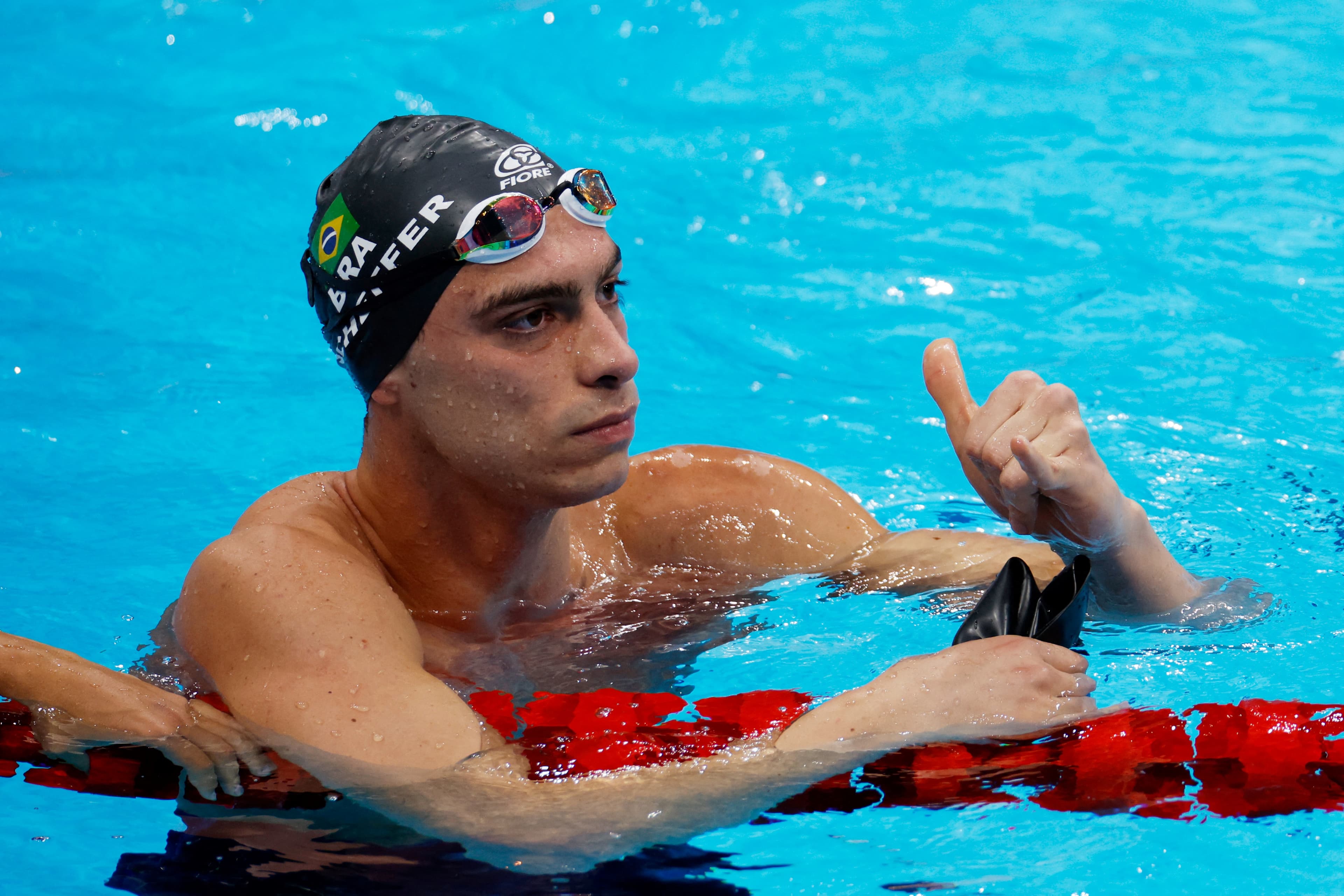 Brazil's Fernando Scheffer competes to win a heat for the men's 200m freestyle swimming event during the Tokyo 2020 Olympic Games at the Tokyo Aquatics Centre in Tokyo on July 25, 2021. (Photo by Odd ANDERSEN / AFP)
