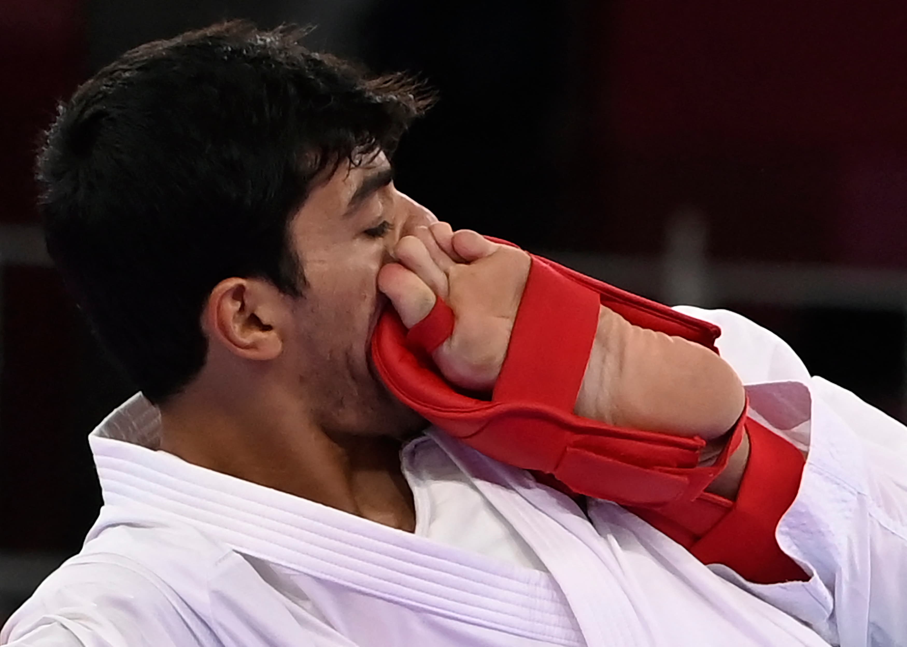 Jordan's Abdel Rahman Almasatfa (L) competes against France's Abdel Rahman Almasatfa competes against in the men's kumite -67kg elimination round of the karate competition during the Tokyo 2020 Olympic Games at the Nippon Budokan in Tokyo on August 5, 2021. (Photo by Alexander NEMENOV / AFP)