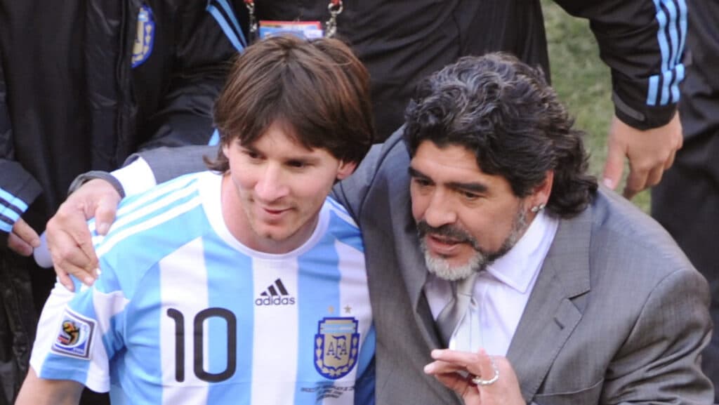 (FILES) In this file photo taken on June 17, 2010 Argentina's coach Diego Maradona (R) and Argentina's striker Lionel Messi speak after their Group B first round 2010 World Cup football match Argentina versus South Korea at Soccer City stadium in Soweto, suburban Johannesburg. (Photo by Gabriel BOUYS / AFP)