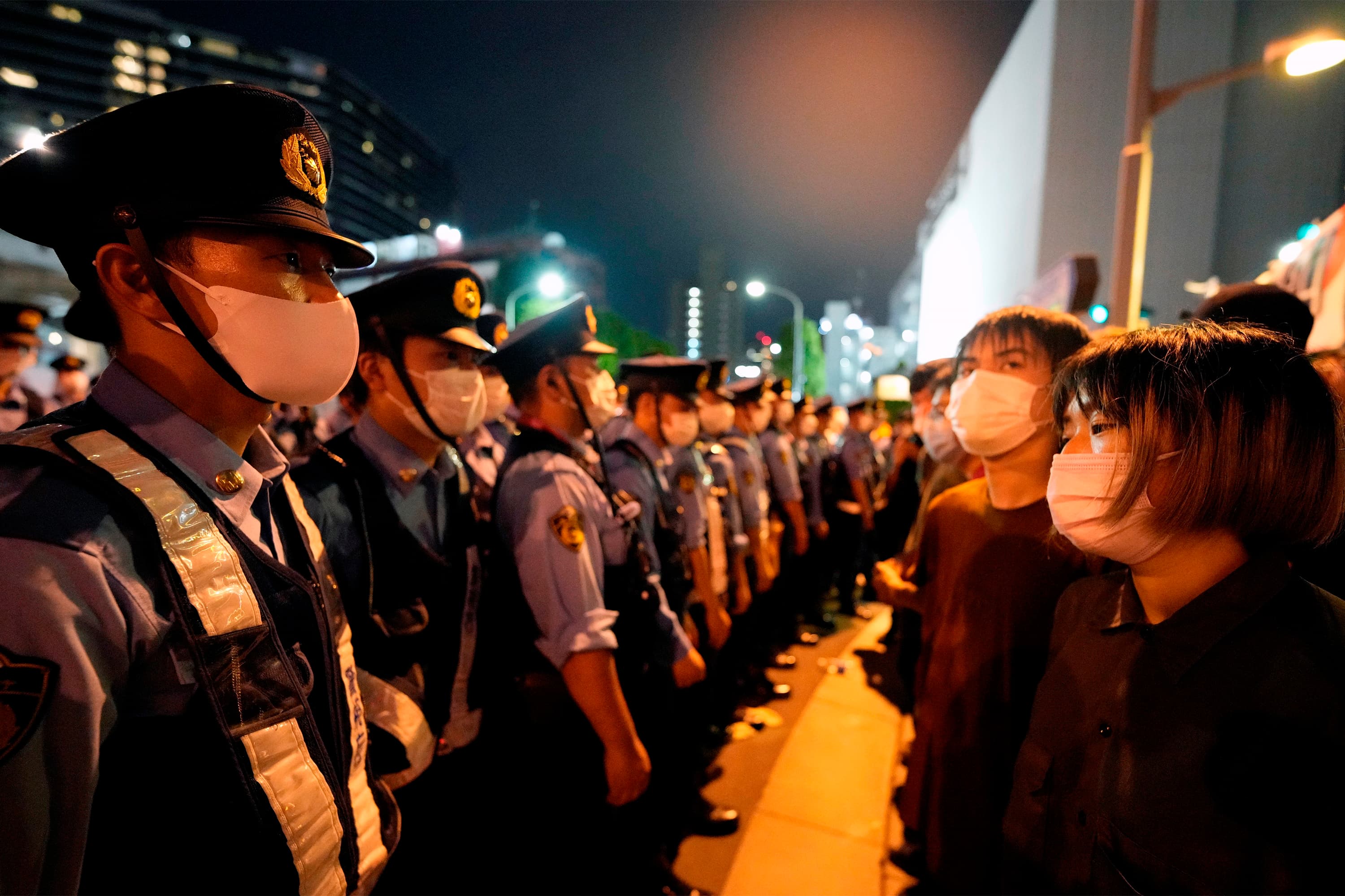 Tokyo (Japan), 23/07/2021.- Police forces block demonstrators in front of the National Stadium during the opening ceremony of the Tokyo 2020 Games in Tokyo, Japan, 23 July 2021. Demonstrators staged a protest against the Tokyo 2020 Olympic Games as the opening ceremony happened in a stadium without spectators. (Protestas, Japón, Tokio) EFE/EPA/FRANCK ROBICHON