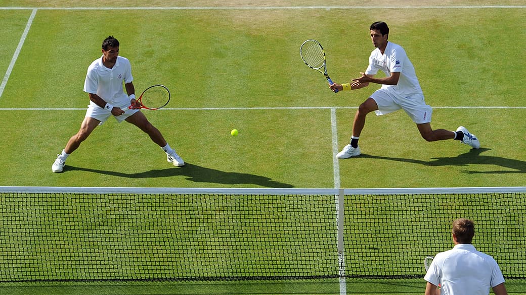 Marcelo Melo e o croata Ivan Dodig durante o torneio de Wimbledon