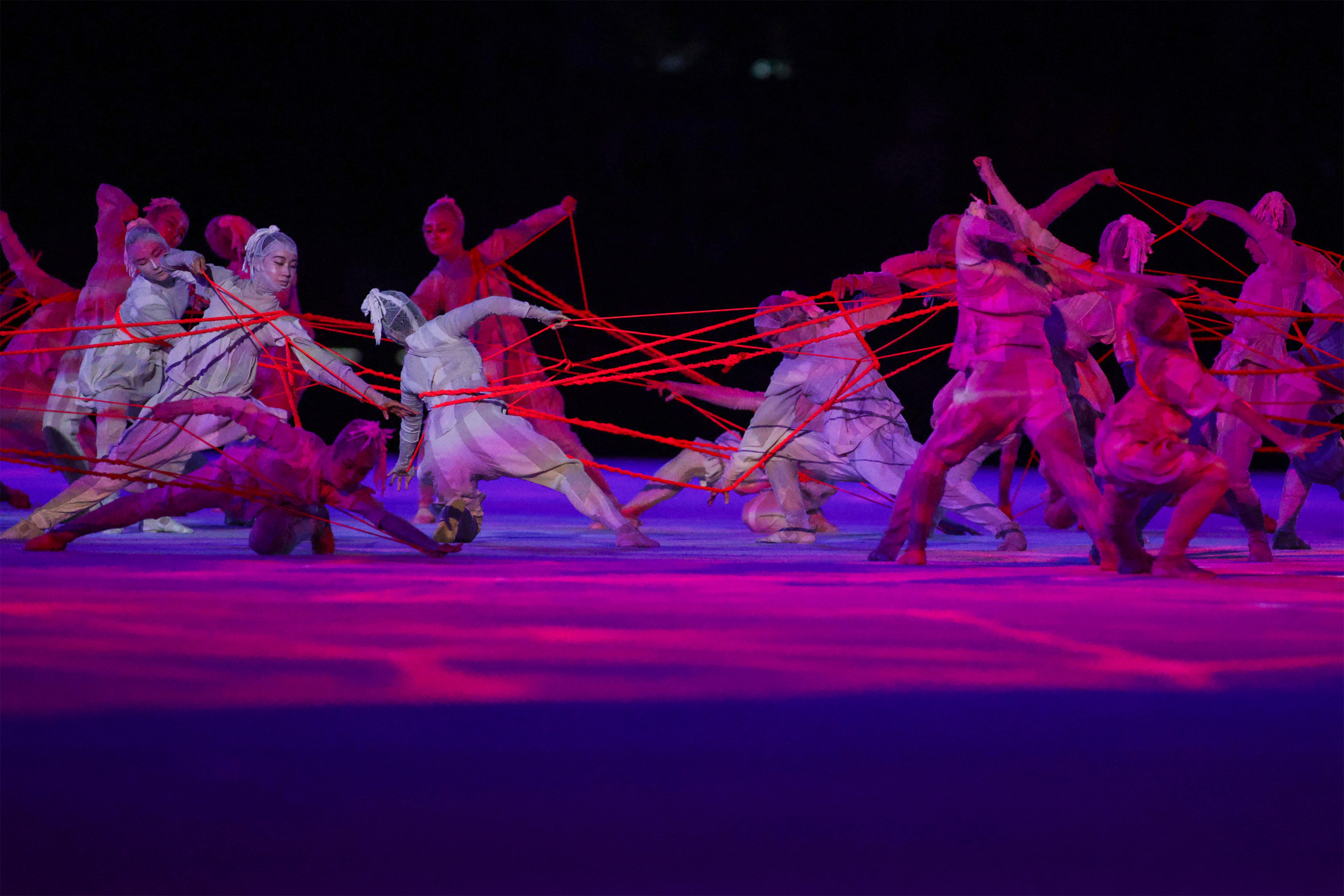 Dancers perform during the opening ceremony of the Tokyo 2020 Olympic Games, at the Olympic Stadium in Tokyo, on July 23, 2021. (Photo by HANNAH MCKAY / POOL / AFP)