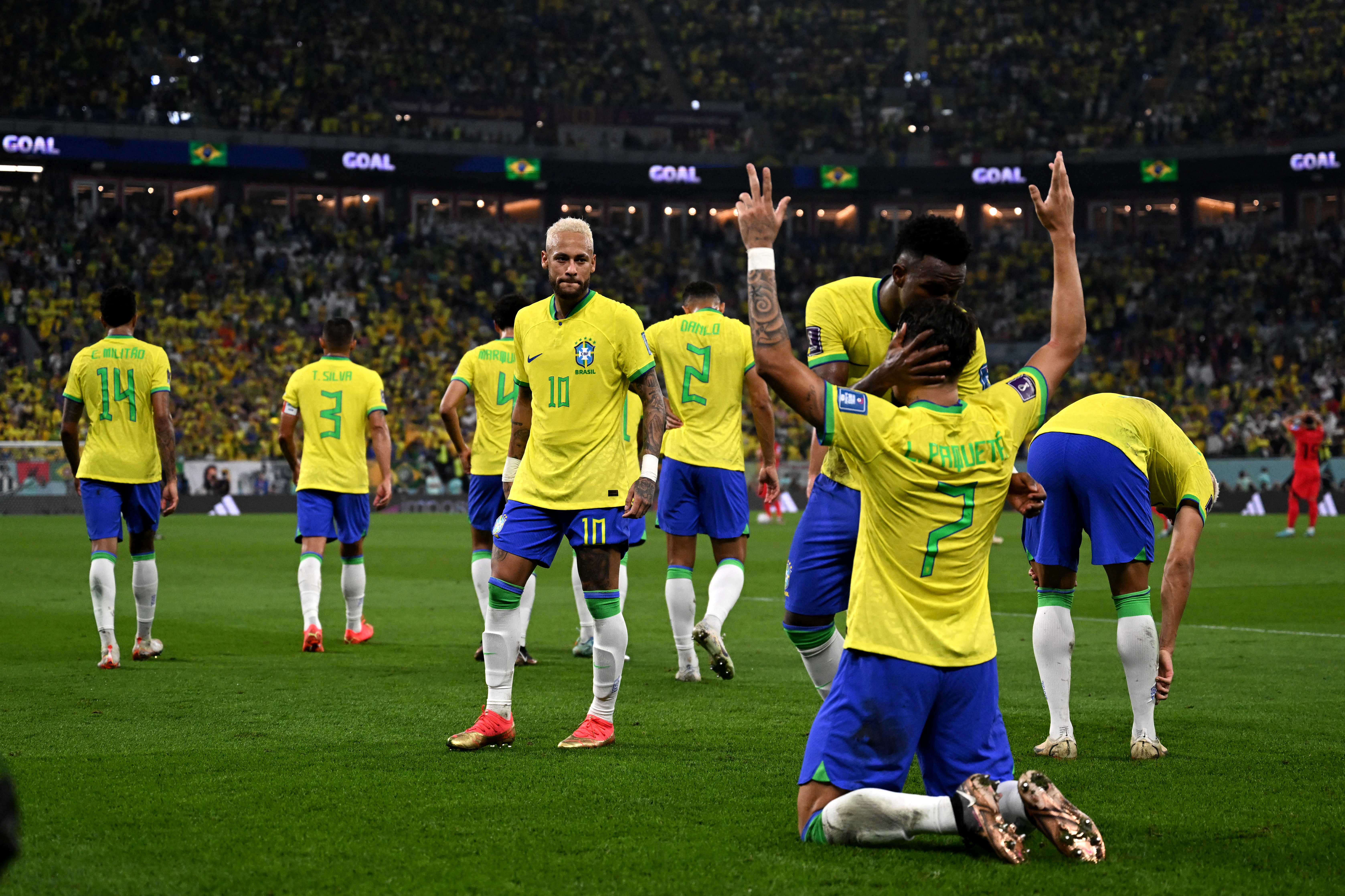 Brazil's midfielder #07 Lucas Paqueta celebrates scoring his team's fourth goal during the Qatar 2022 World Cup round of 16 football match between Brazil and South Korea at Stadium 974 in Doha on December 5, 2022. (Photo by Pablo PORCIUNCULA / AFP)