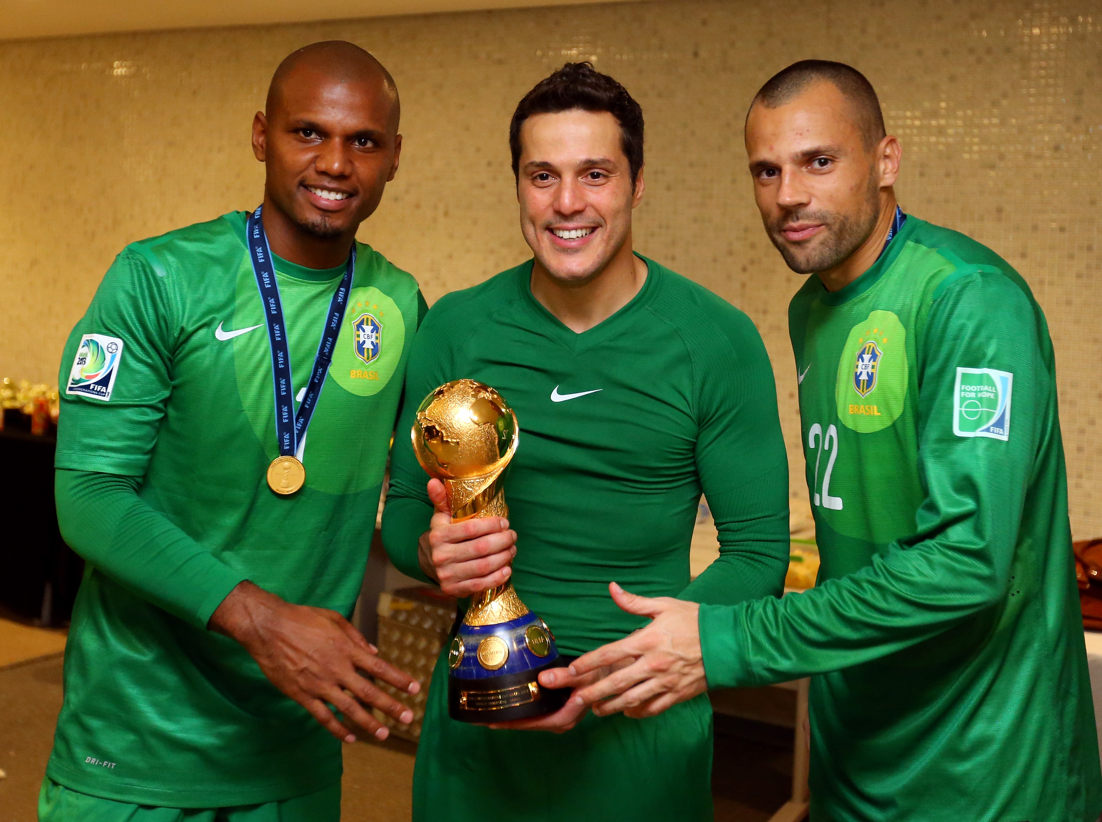 RIO DE JANEIRO, BRAZIL - JUNE 30: (From L to R) Brazilian goalkeepers Jefferson, Julio Cesar and Diego Cavalieri of Brazil pose with the FIFA Confederations Cup trophy after the FIFA Confederations Cup Brazil 2013 Final match between Brazil and Spain at Maracana on June 30, 2013 in Rio de Janeiro, Brazil. (Photo by Alex Livesey - FIFA/FIFA via Getty Images)